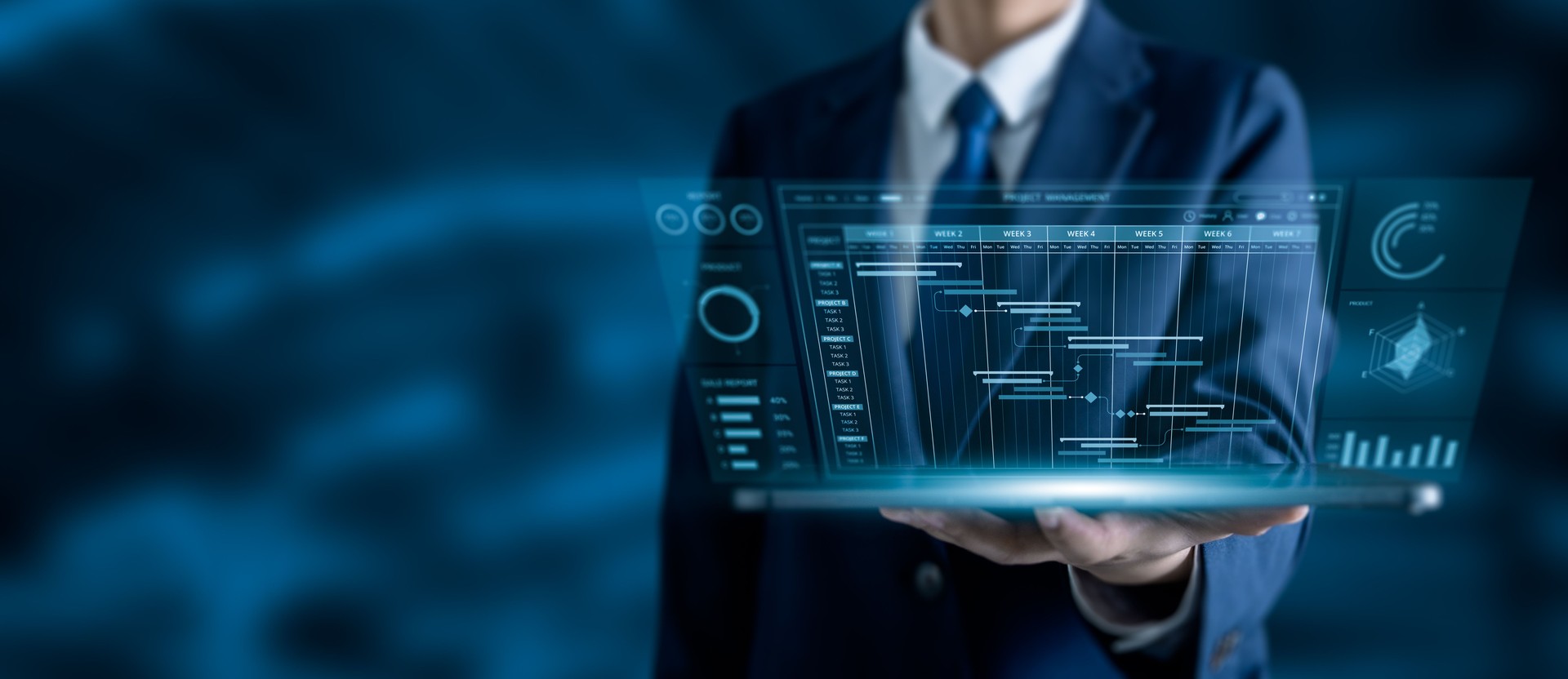Businessman holding tablet with futuristic project management dashboard, timeline gantt chart, and data analytics interface. Project planning, business intelligence, and digital transformation concept